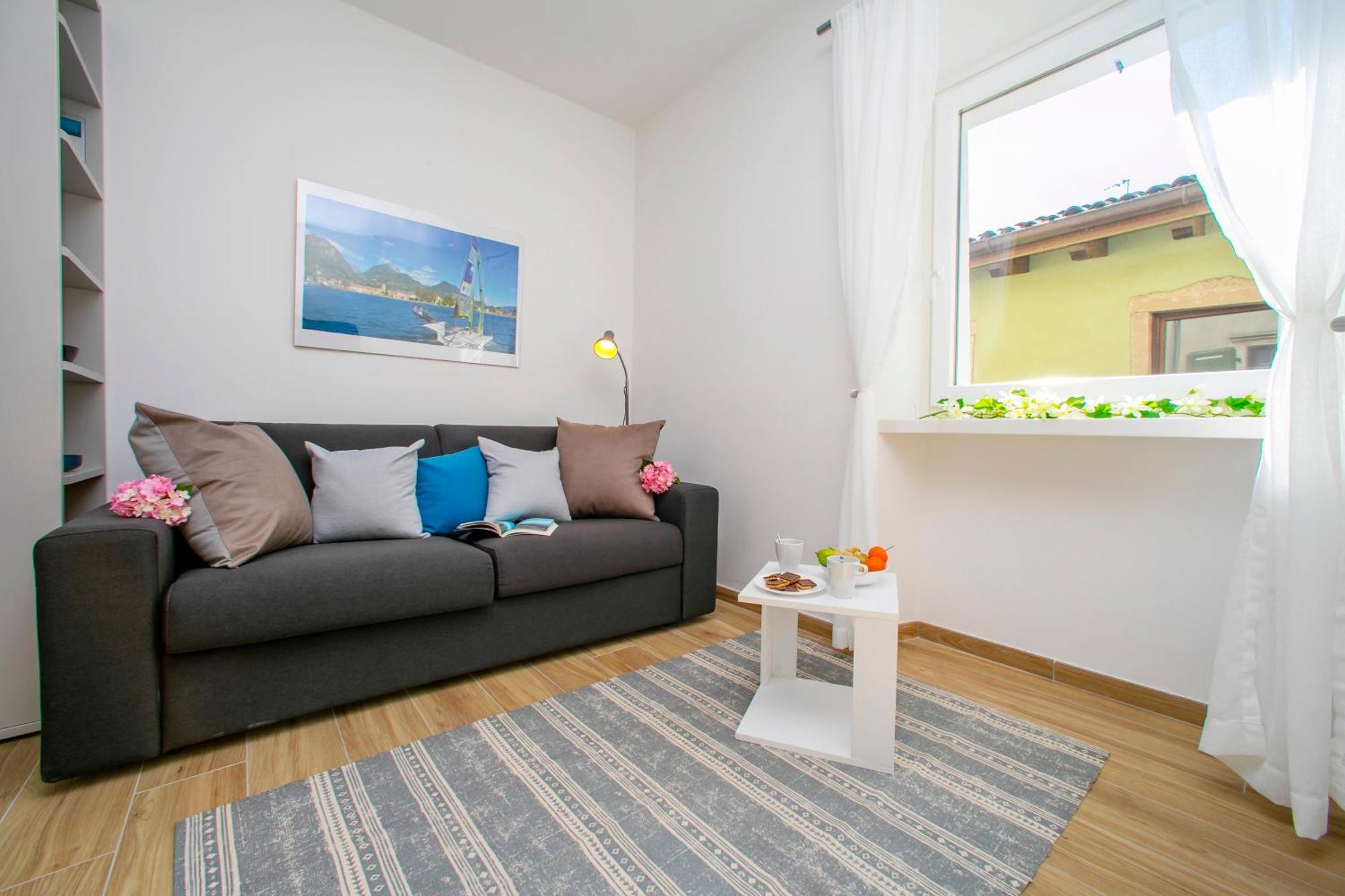 Nido Sui Tetti Di Riva Del Garda - Happy Rentals Luaran gambar