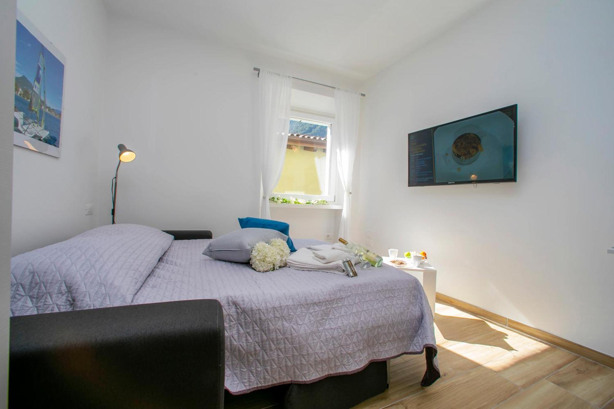 Nido Sui Tetti Di Riva Del Garda - Happy Rentals Luaran gambar